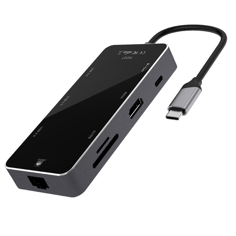 multi-function type c converter showing multiple ports including HDMI, USB, and card readers.